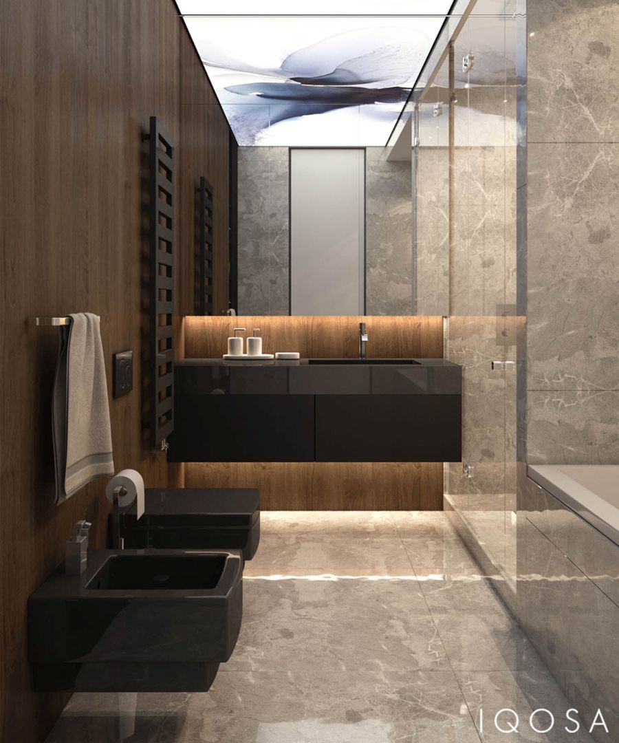 Fürdőszoba márvány falburkolattal és fekete szaniterekkel