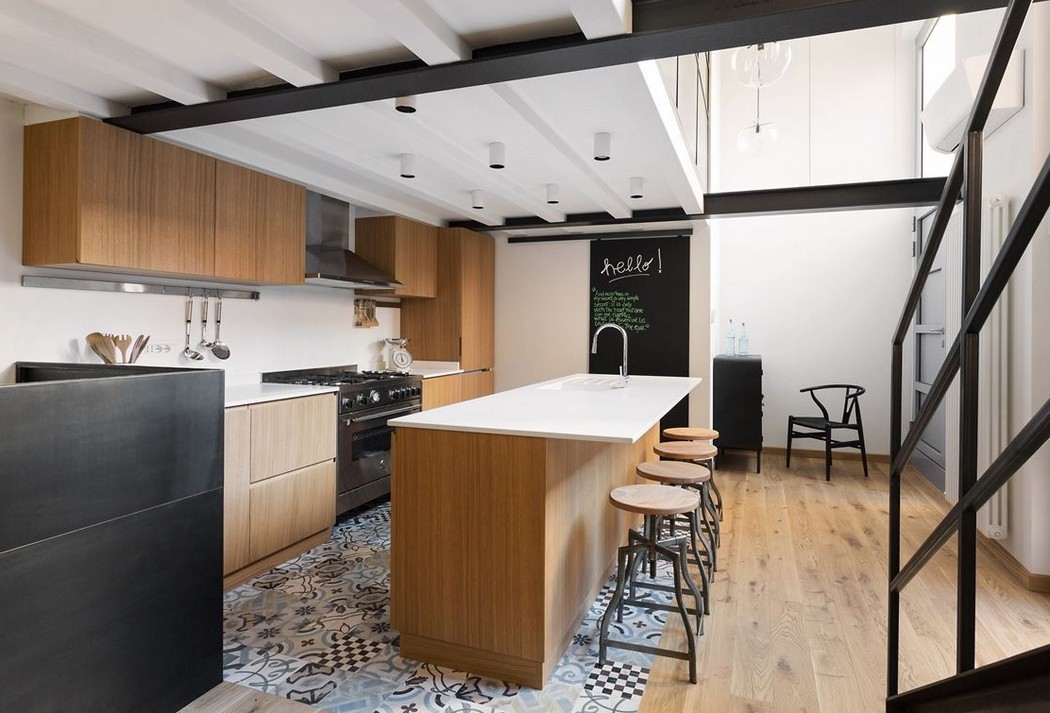 Modern konyha cementlapokkal egy loft lakásban