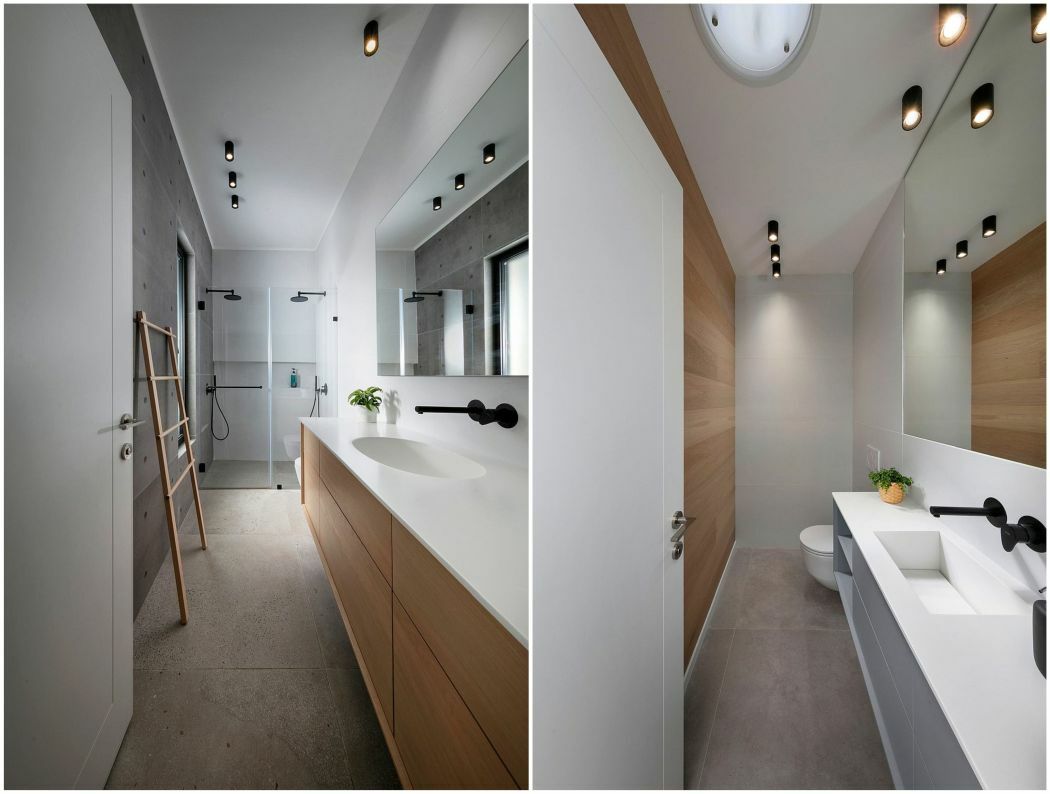 Fürdőszoba berendezés betonos felületekkel fehérrel és fa frontokkal