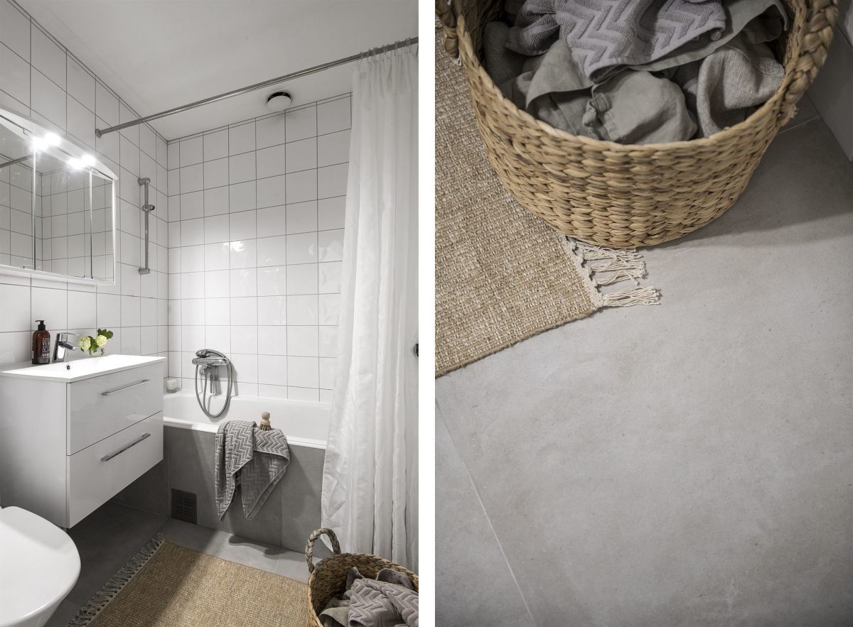 Betonszínű padlólap egyszerű fehér csempével a fürdőszobában