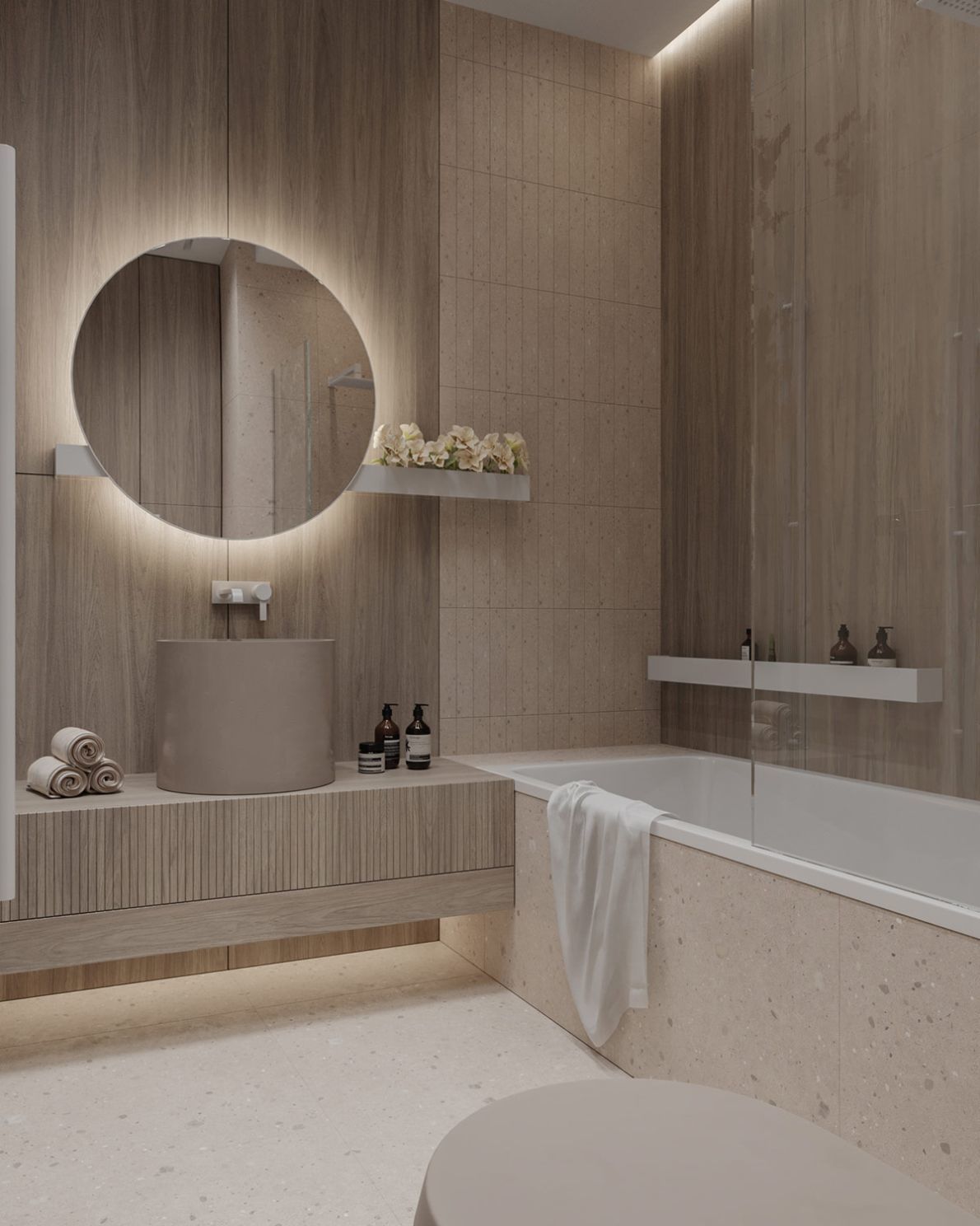 Zuhanyzóval kombinált fürdőkád és modern henger alakú mosdó kombinációja a fürdőszobában
