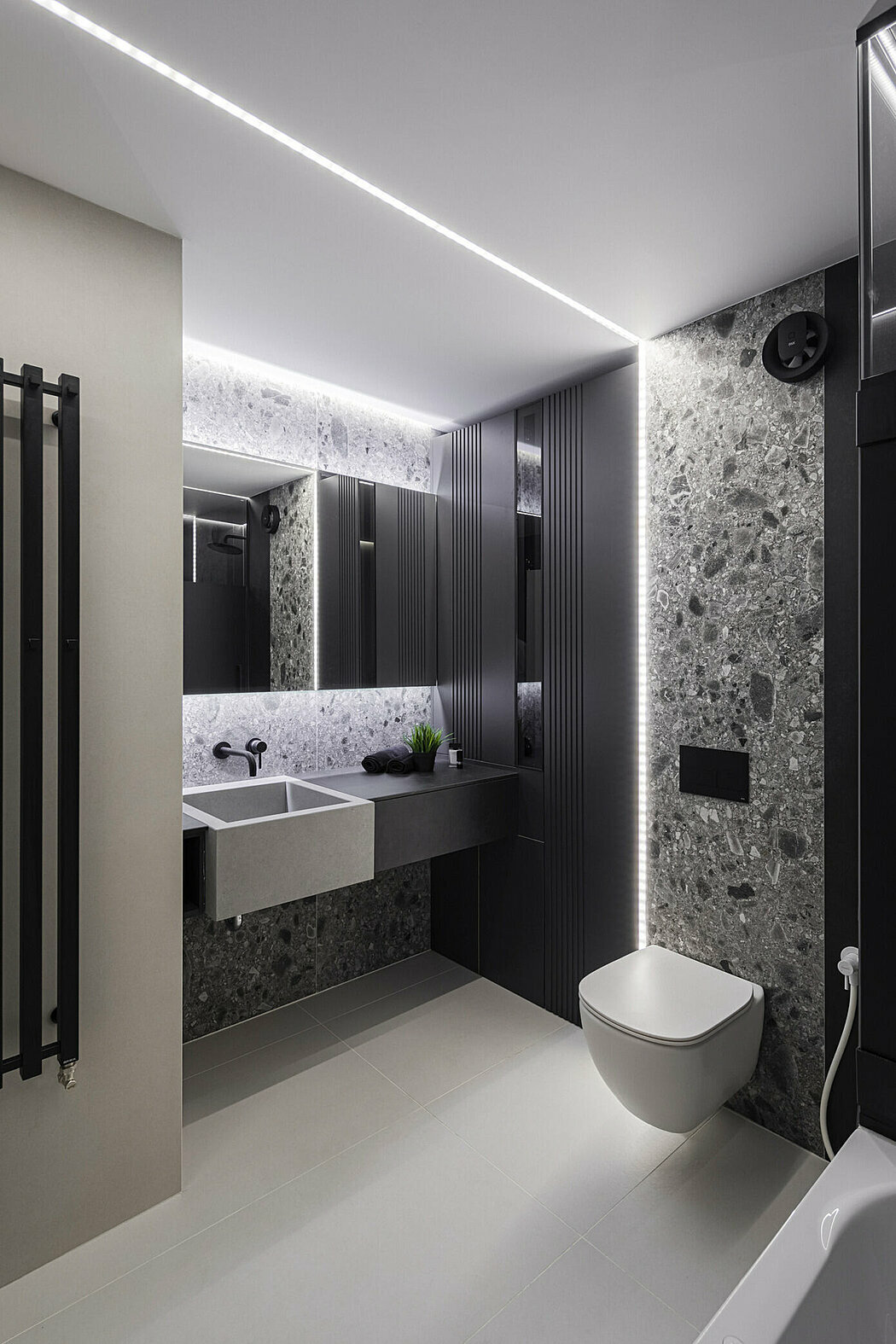 A fürdőszoba részlete kőszemcse mintás lapokkal és rejtet led fénnyel