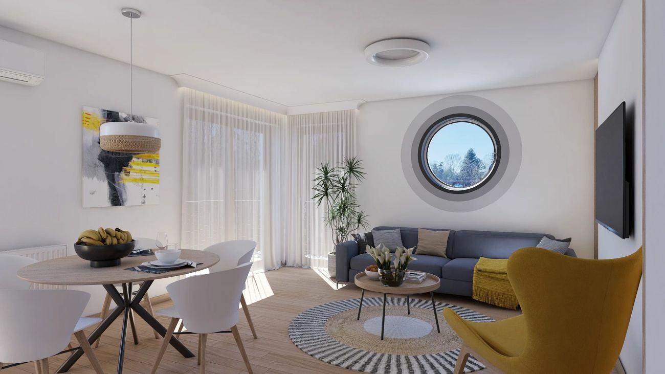 Kerek formák: ablak, szőnyeg, lámpa és az étkezőasztal